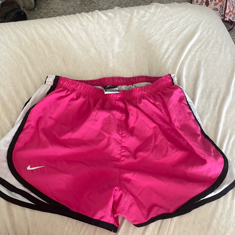 Pink Nike running shorts